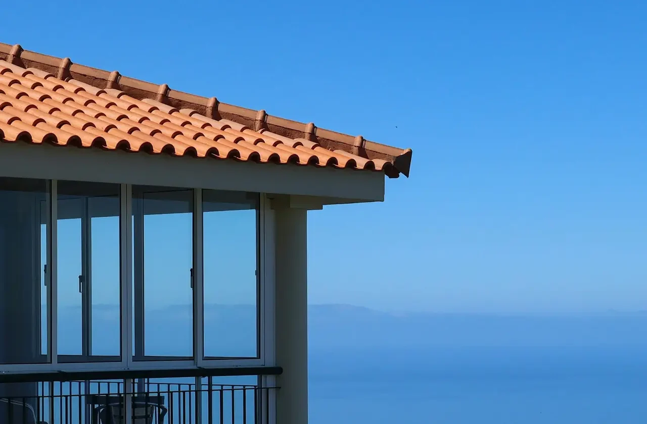 Scenic view of a coastal house overlooking the Atlantic Ocean in Madeira.